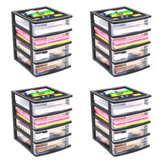 four plastic drawers stacked on top of each other with different colored papers in the bottom