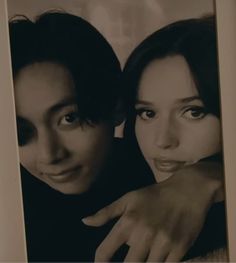 two women are posing for the camera with their hands on each other's shoulders