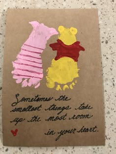 a piece of brown paper with some writing on it and two winnie the pooh bears