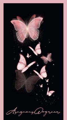 several pink butterflies flying in the dark sky