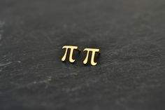 Pi Math Earrings, Pi Science Jewelry Stud Earrings, Geek Nerd Teacher Student Jewelry Gift, 14K Solid Gold This is a pair of a Pi stud earrings in 14K Solid Gold. Totally cute tiny earrings for a geeky style! Would make a perfect distinctive gift for someone special! Measurements approx.: 6.7mm Material: 14K Solid Gold Also check more --Earrings-- http://www.etsy.com/shop/HardResols?section_id=11614037 And my shop here: http://www.etsy.com/shop/HardResols >----REGISTERED MAIL WITH TRACKING NU Teacher Jewelry Gifts, Math Earrings, Nerd Earrings, Math Jewelry, Nerd Jewelry, Pi Math, Marvel Jewelry, Teacher Jewelry, Geeky Fashion