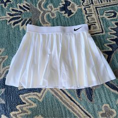 White Nike Victory Skirt Size Small Nwot Never Worn So Cute! Pleated Tennis Skirt 304 Nike Fitted Tennis Skirt For Spring, Nike Fitted Tennis Skirt, Nike Fitted Pleated Skirt, Nike Pleated Skort For Spring, Nike Casual Pleated Skirt, Nike Lined Skirt For Spring, Fitted Nike Pleated Skirt, Nike Mini Tennis Skirt For Spring, White Flowy Lined Tennis Skirt