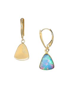 Earrings with rounded triangle Ethiopian opal set in 22k gold bezel dangling from 14k gold lever back hooks. Earrings hang 1". Sourced directly from the Wollo Valley in Ethiopia, these opals are known for their vivid play-of-color and are purchased directly from small miners, supporting local villages. Each gem is polished and set in gold in Tucson, Arizona Tucson Arizona, Triangle Earrings, Pretty Jewellery, 22k Gold, Ethiopia, Ethiopian Opal, Tucson, Triangles, Arizona