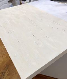 a white counter top sitting on top of a hard wood floor