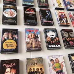 many movies are being displayed on the wall in order to be read by someone else