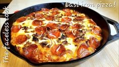 a pepperoni pizza in a cast iron skillet on a wooden table with the caption, the recipe is out