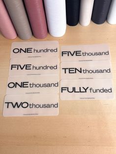 four stickers with the words five hundred and two thousand in black, white, and pink