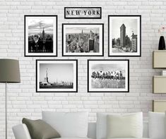 a living room with white brick walls and pictures on the wall, including new york