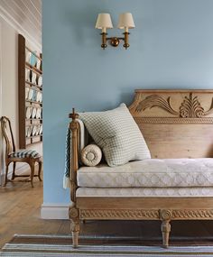 a white couch sitting on top of a wooden floor