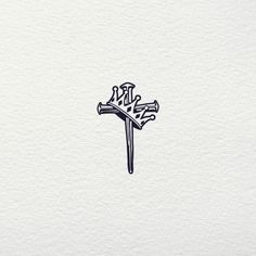 a drawing of a cross with the word jesus on it's side, in black ink