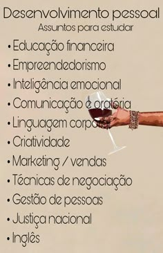 a hand holding a wine glass with the words desanvolimento pessol