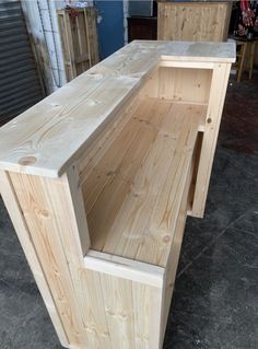 two unfinished wooden benches sitting next to each other