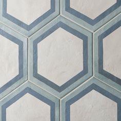 an image of hexagonal tiles in blue and white colors on the wall or floor