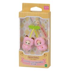 two pink stuffed animals are in a box with keychain attached to the handle