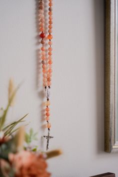 “It is love alone that gives worth to all things.” // Saint Teresa of Avila Introducing handcrafted Rosaries, prayerfully created by Blessed is She and inspired by great Saints. Carefully designed to be durable and beautiful, we’re honored to bring this prayer tool into your hands. This Rosary, inspired by Saint Teresa of Avila, features fiery, multicolored oranges and reds inspired by her passion for Jesus. Each bead of this Rosary is meticulously crafted from high-quality matte stones, creatin Handmade Spiritual Rosary, Mexican Catholic Art, Rosary Ideas, St Teresa Of Avila, Saint Teresa Of Avila, Teresa Of Avila, St Teresa, Church Candles, Life Of Christ