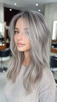 Ash gray is a chic, modern shade that perfectly complements pale skin, offering a cool and sophisticated look. This trendy color adds depth and elegance, making it a fabulous choice for those seeking an edgy yet refined style. Click the pin for more inspiration and follow us for the latest hair color trends! #AshGray #HairColorInspo #CoolTones #ModernStyle #PaleSkinPerfection Stunning Hair Color Ideas, Women’s Silver Hair, Blonde Gray Balayage, Light Grey Hair Color, Ash Grey Hair Color Silver, Grey Hair Grow Out, Gray Hair Highlights Silver Ash Blonde, Ash Hair Color Grey, Ash Gray Hair Color Short Hair