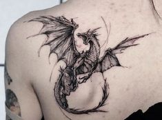 a woman with a dragon tattoo on her back