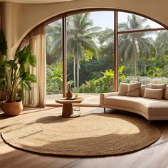 a living room with an arched window overlooking the jungle