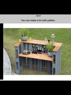 a table made out of pallets with bottles on it