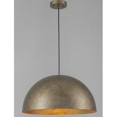 an industrial style pendant light hanging from a metal ceiling fixture with a gold shade on the top