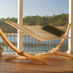 a hammock sitting on top of a wooden stand