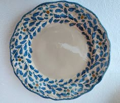 a blue and white plate sitting on top of a table