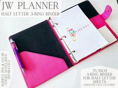 a pink and black binder with a notepad, pen and paper on it