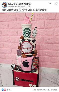 a cake made to look like a starbucks cup with pink frosting and cookies on top