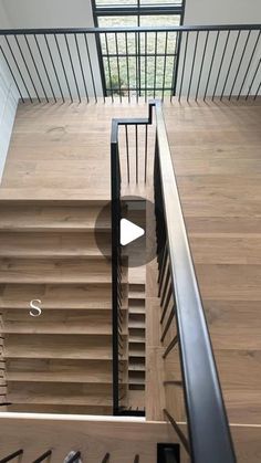 the stairs are made of wood and have metal handrails