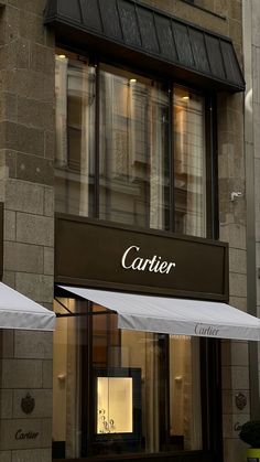 a store front with an awning on the side of it's building that says carrier