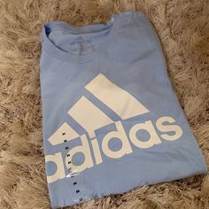 New With Tags Woman’s Adidas Light Blue T-Shirt. Beautiful Powder Blue Color With White Adidas Logo. Size Medium Adidas Shirt Women, Light Blue T Shirt, Powder Blue Color, Adidas Tshirt, Adidas Crop, Adidas T Shirt, Orange T Shirts, Black Crewneck, Adidas Shirt