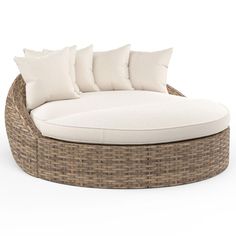 an outdoor daybed with white cushions and pillows on the top, in front of a white background