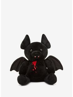 a black stuffed bat with blood dripping down the middle of it's body and eyes