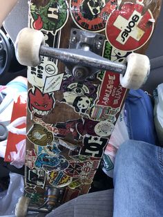 a skateboard with many stickers on it