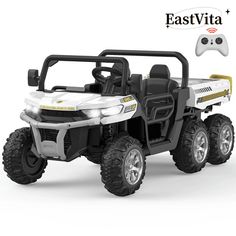 a white and black toy atv with remote control on the front, side by side