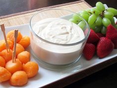 grapes, strawberries and dip on a tray