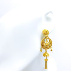 Adorned with delicate floral motifs, these 22k yellow gold earrings exude elegance. Weighing 15.8 grams with a 2.8" drop length, their luminous finish complements any look. Featuring a secure screw-back post Product Details Gold Purity(karat): 22k Gold Weight(grams): 15.8 Item Finish: Yellow Gold Earring Style: Hanging/Jhumki Earring Length: ﻿2.8" Earring Post: Screw Back Chand Bali, 22k Gold Earrings, Jhumki Earrings, Yellow Gold Earrings, Earring Post, Gold Earring, Yellow Gold Earring, Floral Motifs, 22k Gold