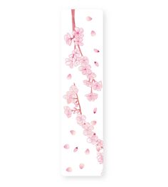 a bookmark with pink flowers hanging from it's side on a white background