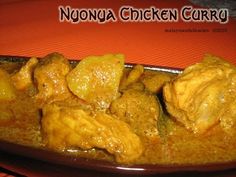 chicken curry in a brown bowl on top of an orange place mat with the words nuonga chicken curry above it