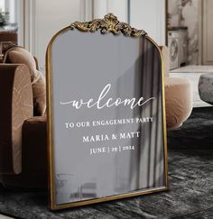 a welcome sign sitting on top of a rug in front of a couch and chair