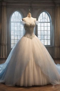 a wedding dress on display in front of two windows