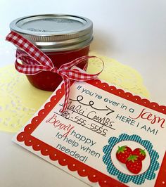 a jar of jam sitting on top of a table next to a label that says happy mother's day