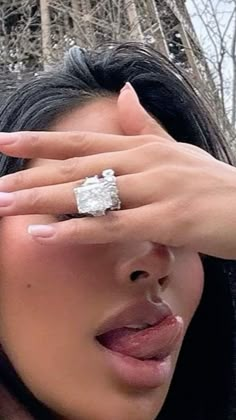 a close up of a person wearing a ring