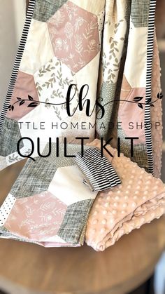 the quilt kit is sitting on top of a table with text overlaying it