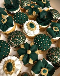 cupcakes decorated with green and gold decorations