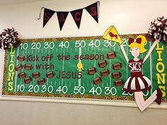 a football field sign with cheerleaders on it