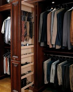 the closet is full of clothes and ties