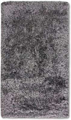 an area rug that is made out of grey fur