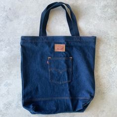 - Levi’s - Tote Bag - Jeans - New With Tags - Internal Pocket - See Pictures For Detailed Measurements Shopping Bag With Removable Pouch In Denim, Everyday Denim Shoulder Bag With Handles, Everyday Denim Tote Bag, Blue Medium Everyday Bag, Everyday Medium Blue Bag, Medium Blue Everyday Bag, Everyday Denim Bags With Handles, Large Bags With Pockets, Large Everyday Bags With Pockets