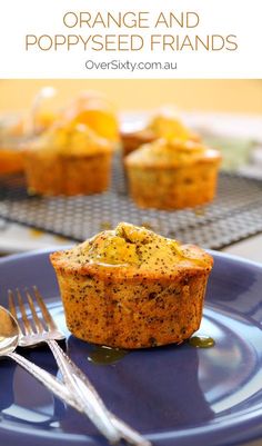 an orange and poppy seed muffin on a blue plate